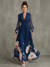 Sofia | Elegant maxi dress with a pleated skirt and sheer long-sleeve look